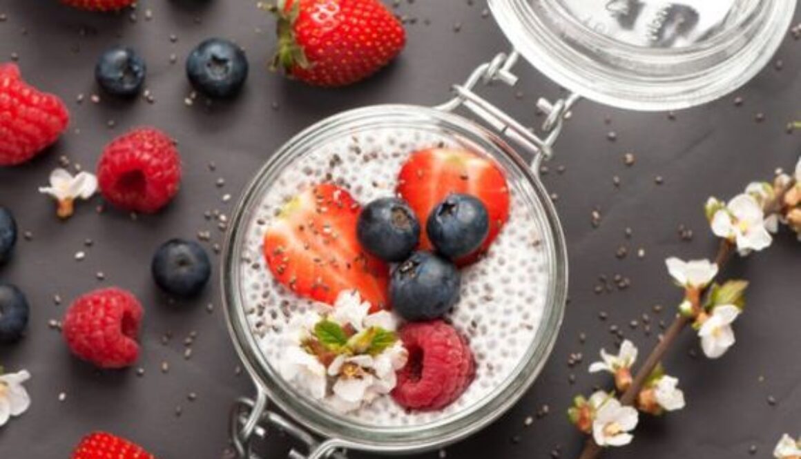 Chia seeds pudding with coconut milk and fresh berries . top view