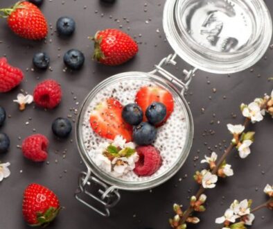 Chia seeds pudding with coconut milk and fresh berries . top view