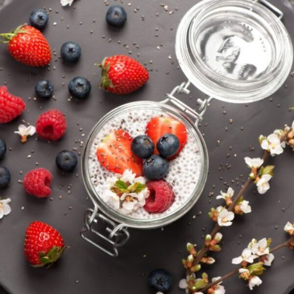 Chia seeds pudding with coconut milk and fresh berries . top view